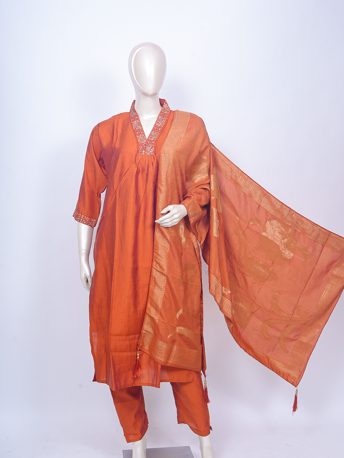 Orange art silk kurti set with embroidered V-neck and gold zari woven dupatta