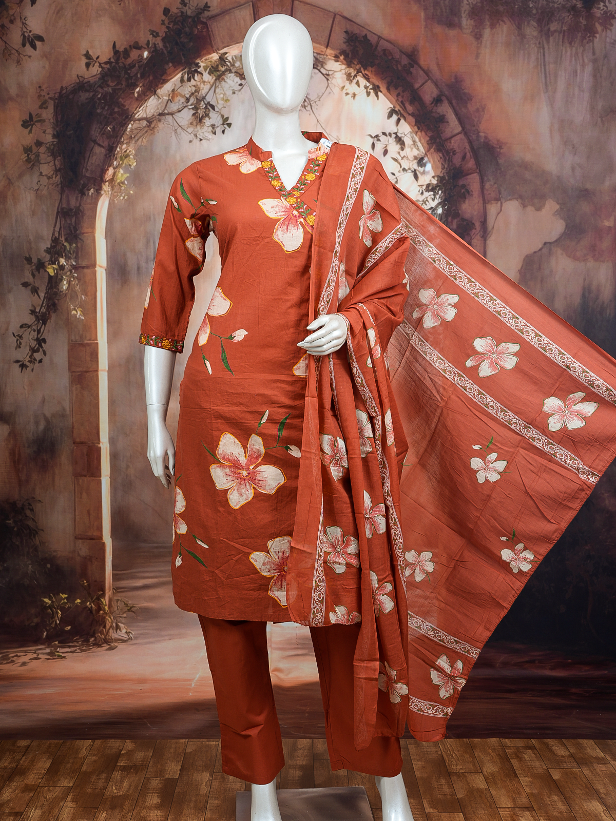 Rust floral cotton kurti set with embroidered neckline, straight pants and printed dupatta
