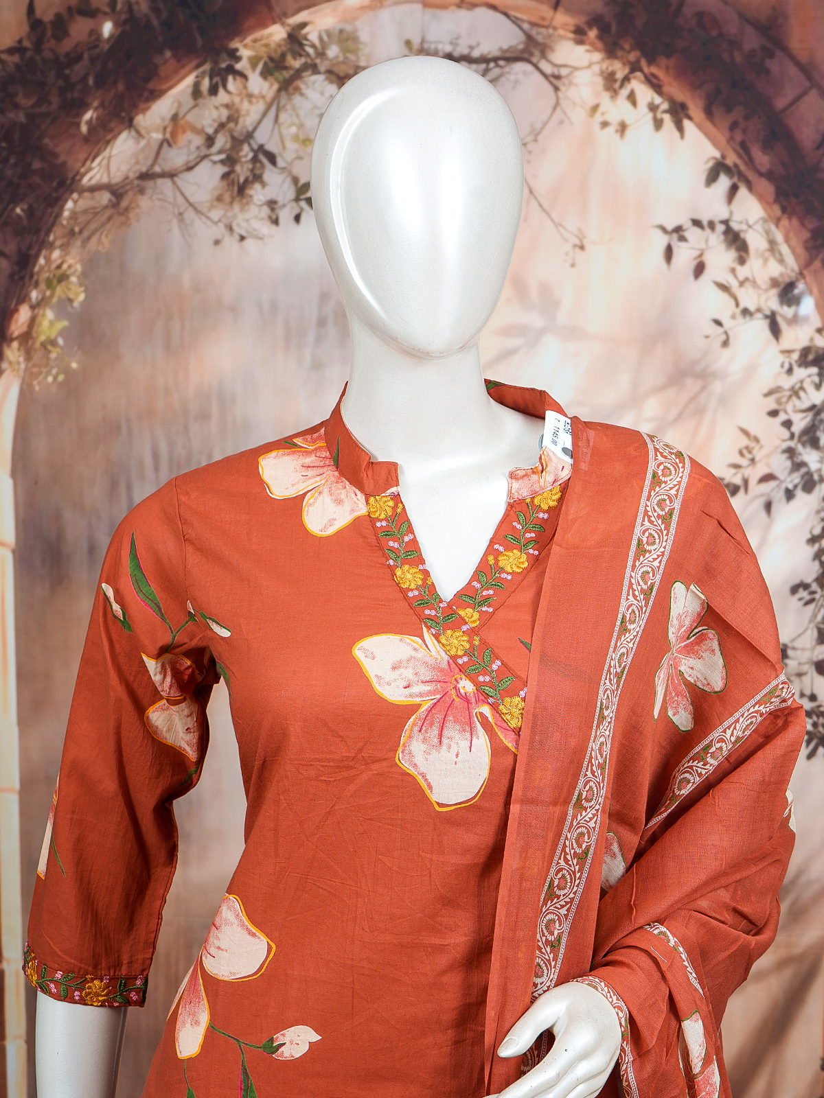 Rust floral cotton kurti set with embroidered neckline, straight pants and printed dupatta