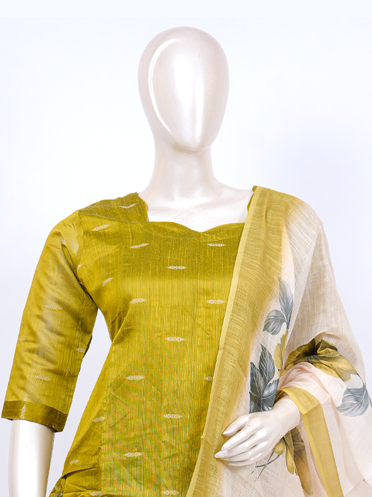 Mustard green textured silk kurti set with zari butis, beige straight pants and floral print cream dupatta