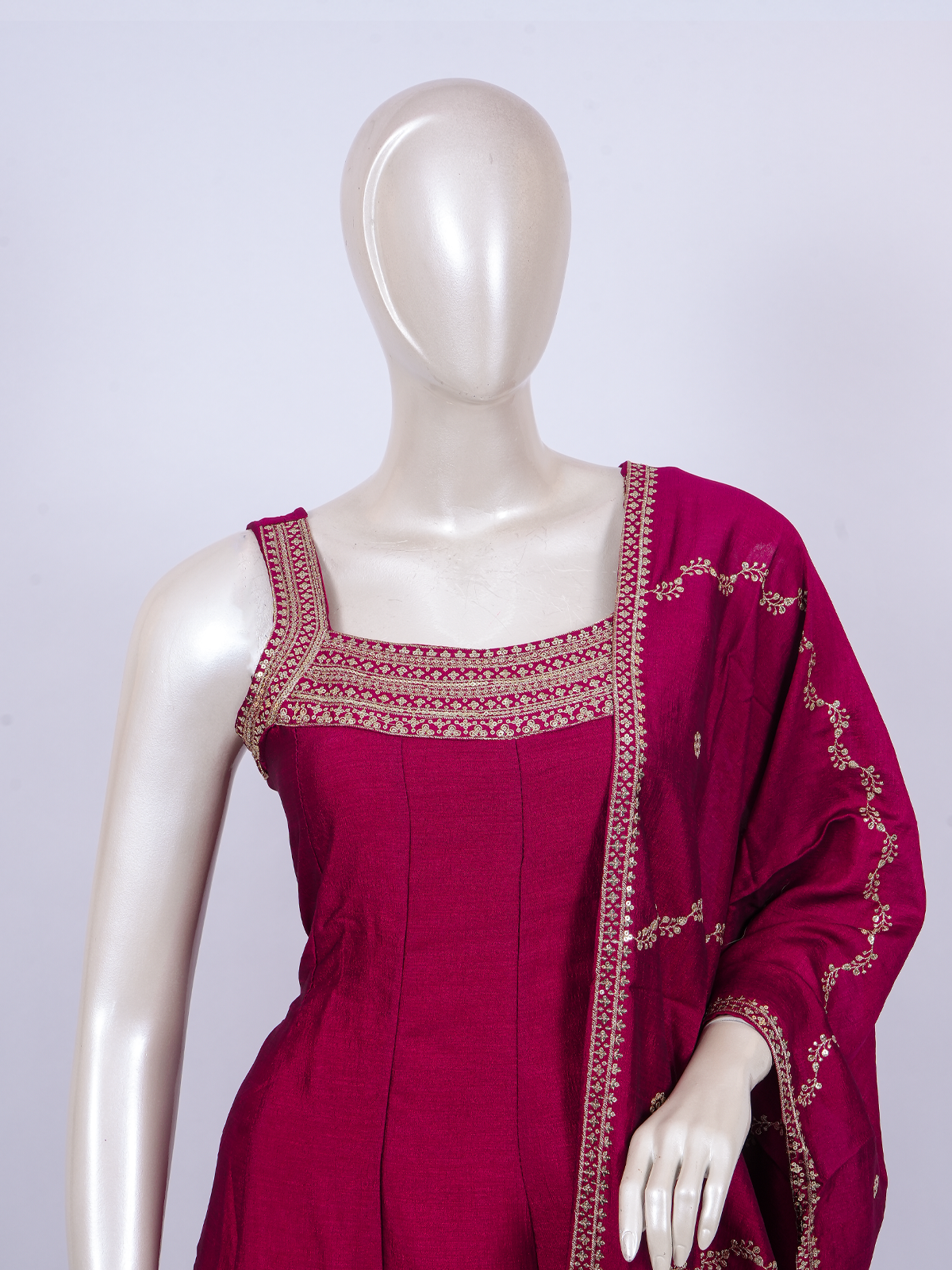 Rani Pink zari embroidered sleeveless A-line kurti set with straight pants and matching embroidered dupatta