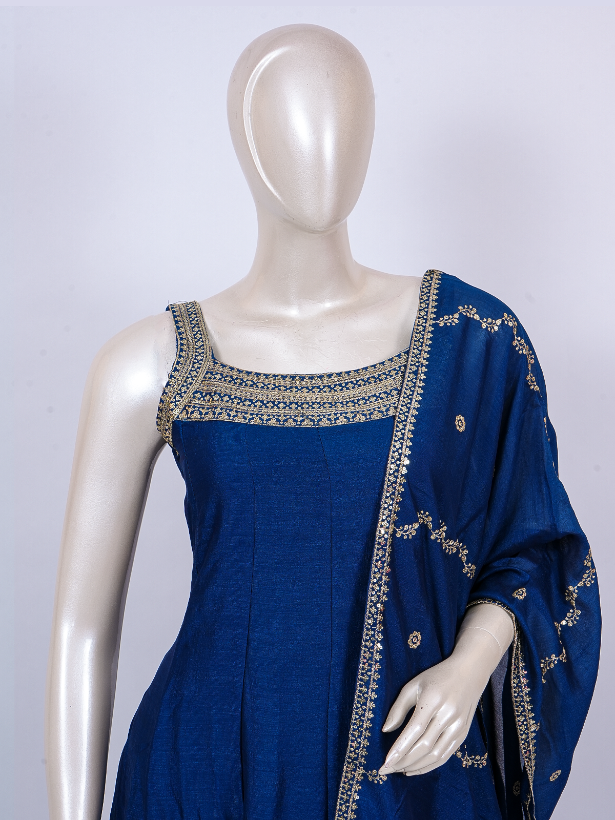 Royal Blue sleeveless A-line kurti set with gold Zari embroidery and matching dupatta