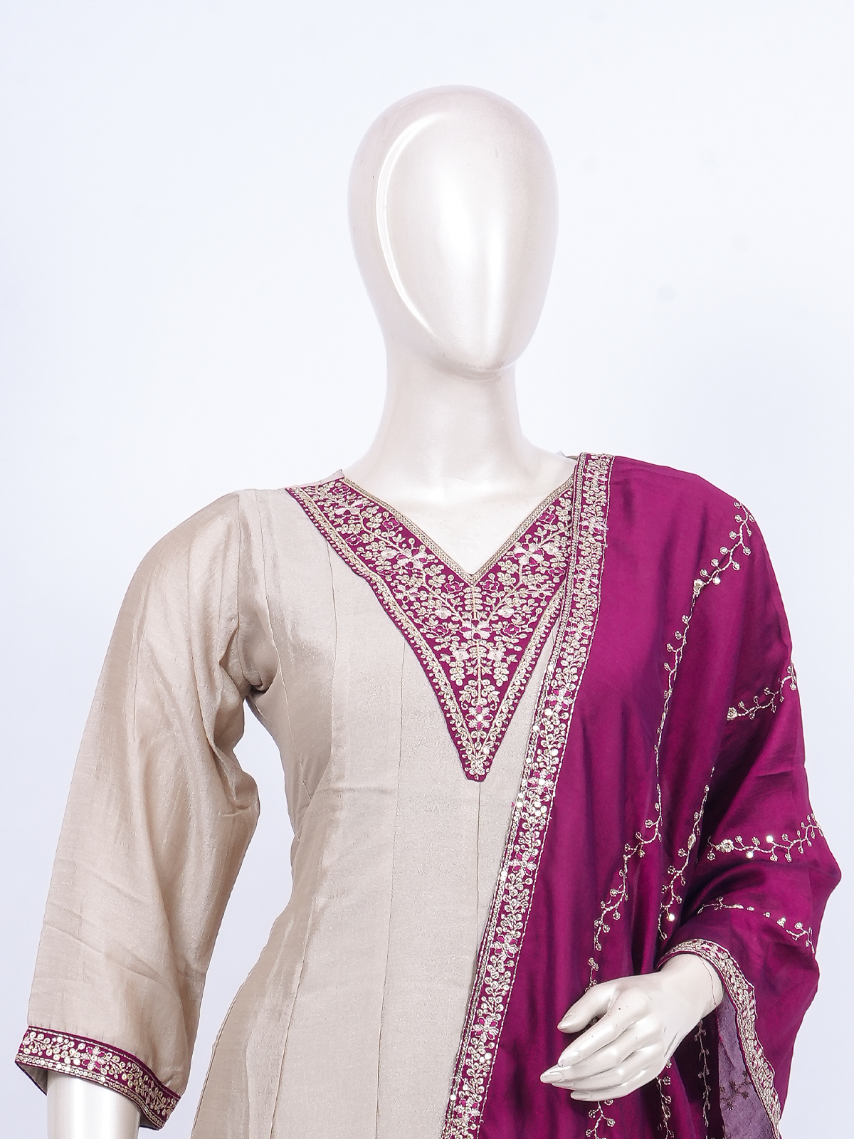 Beige straight-cut kurti set with zari embroidery and contrasting magenta embroidered dupatta