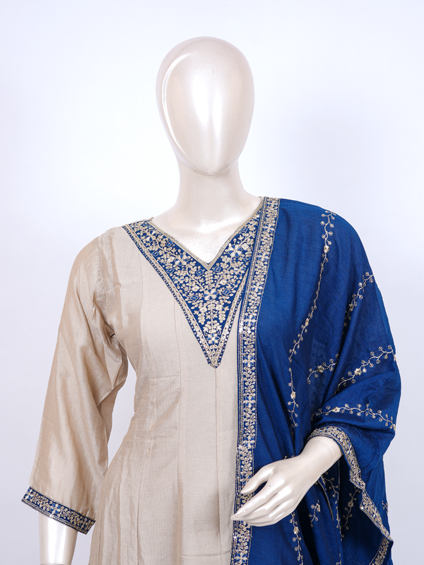 Beige straight-cut kurti set with zari embroidery and royal blue embroidered dupatta and straight pants