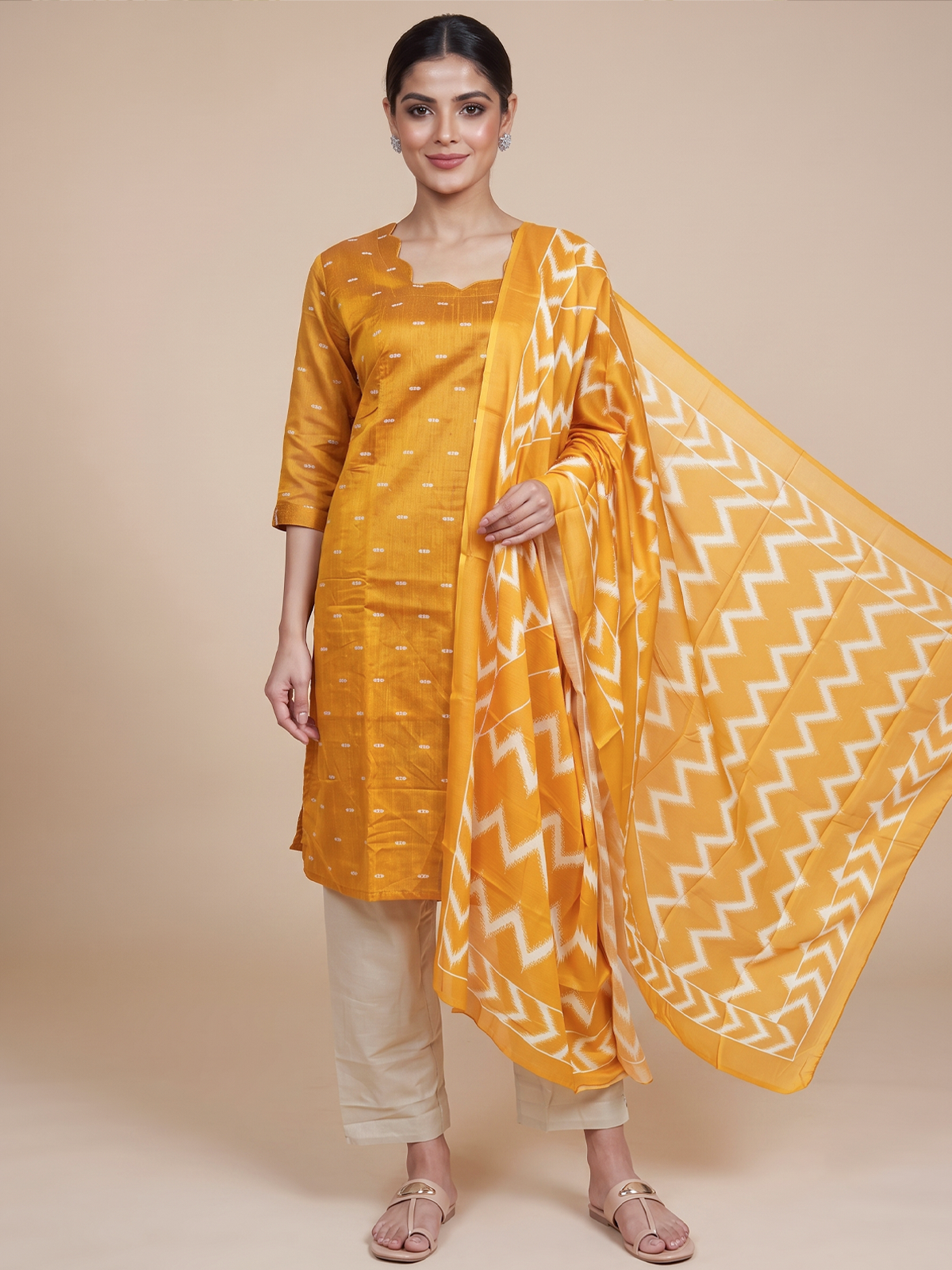 Mustard yellow woven buti kurti set with cream pants and ikat chevron print dupatta